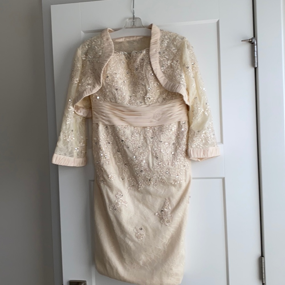 A beautiful cream strapless dress with jacket